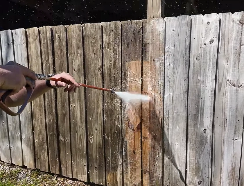 Pressure washing a woodence fence in Reno nevada Caughlin Ranch